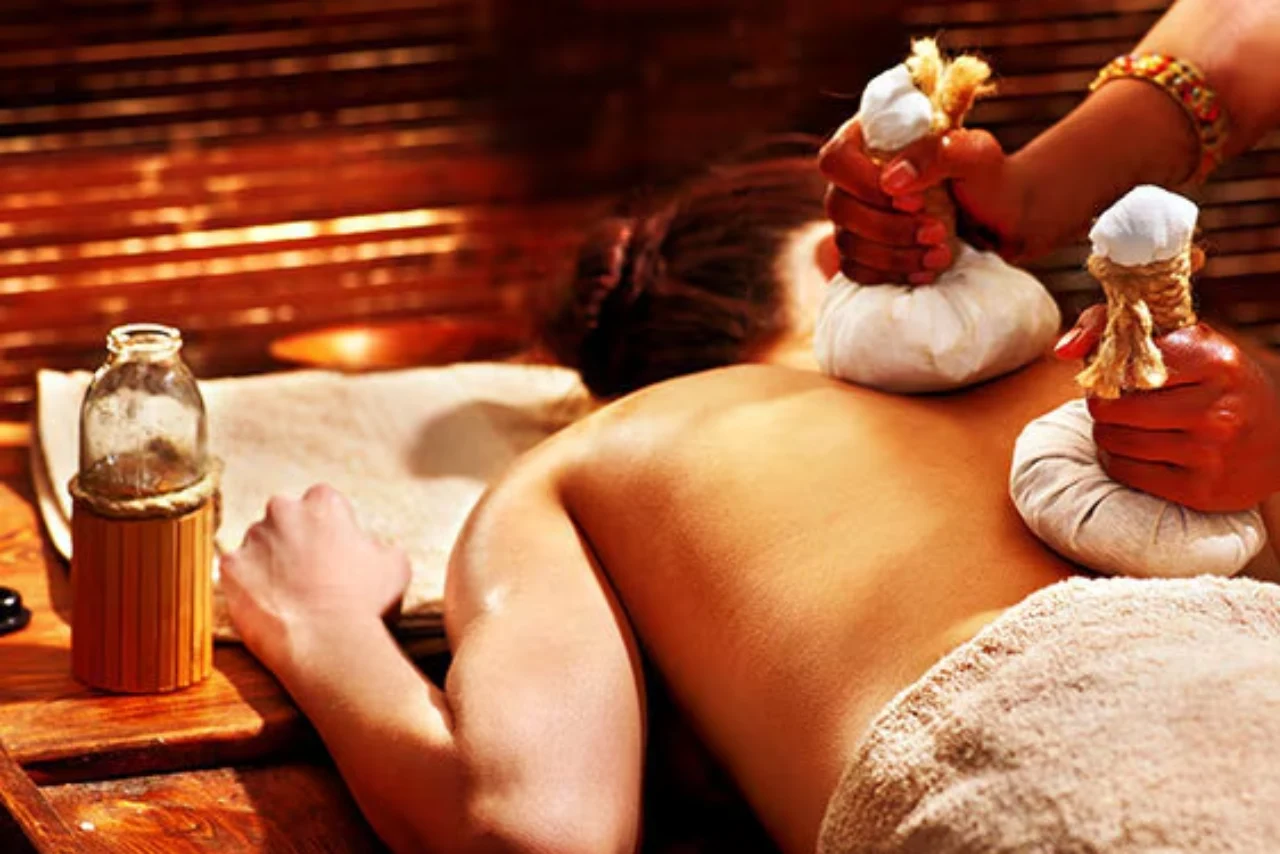 woman receiving herbal potli massage at Honey Grand International Spa in Bangalore