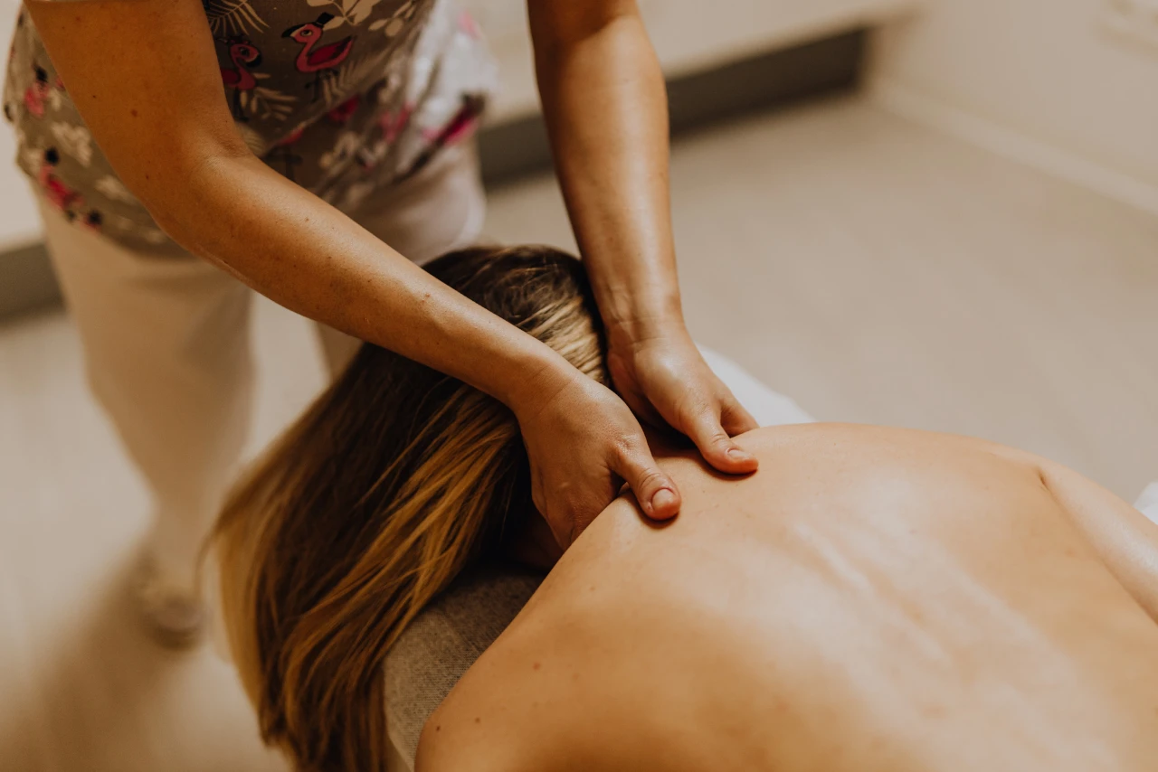 therapist performing thai body massage on back and shoulders at Honey Grand International Spa in Bangalore