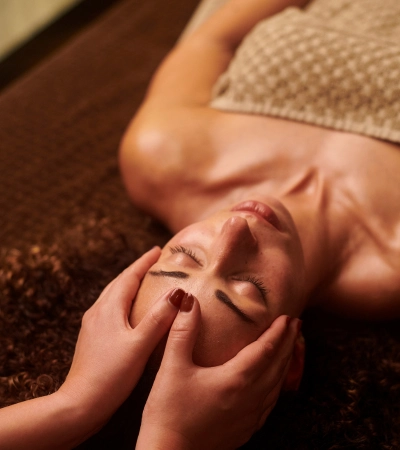 Best Wine Massage in Bangalore with expert therapist providing relaxing head massage in a luxury spa setting