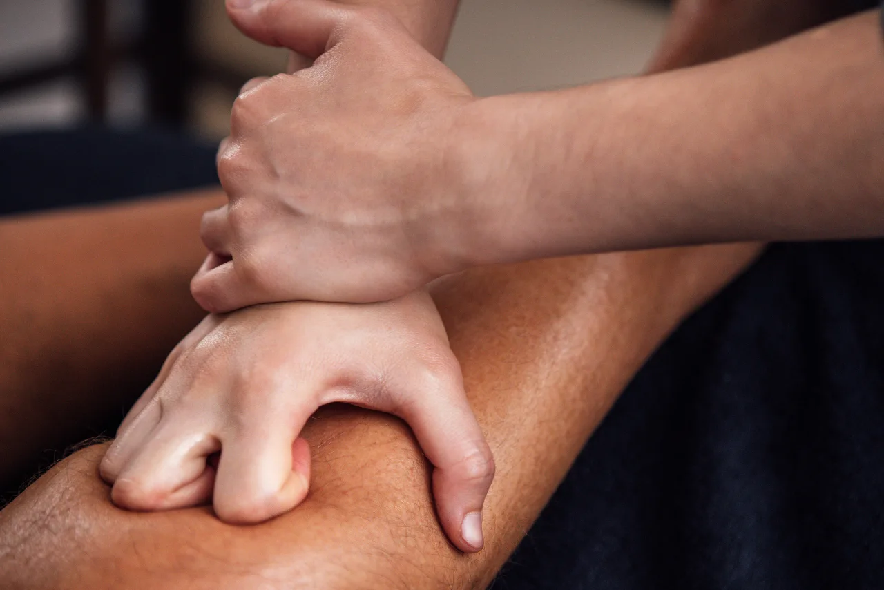 therapist performing deep pressure massage for muscle recovery in Bangalore